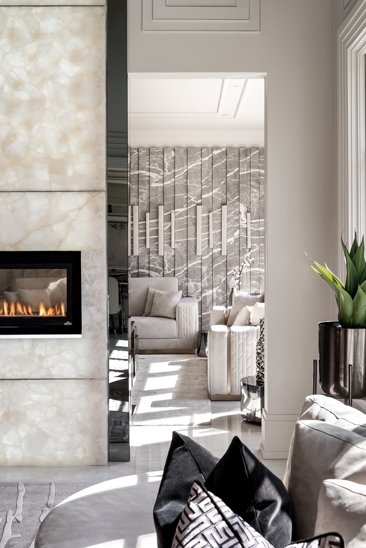 Grand foyer with the backlit onyx hearth panel switched on.