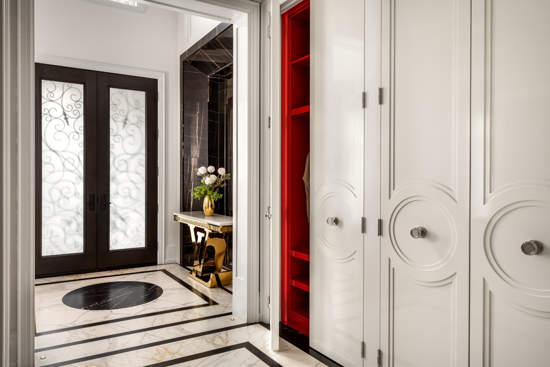 Vestibule with wrought-iron scroll doors.