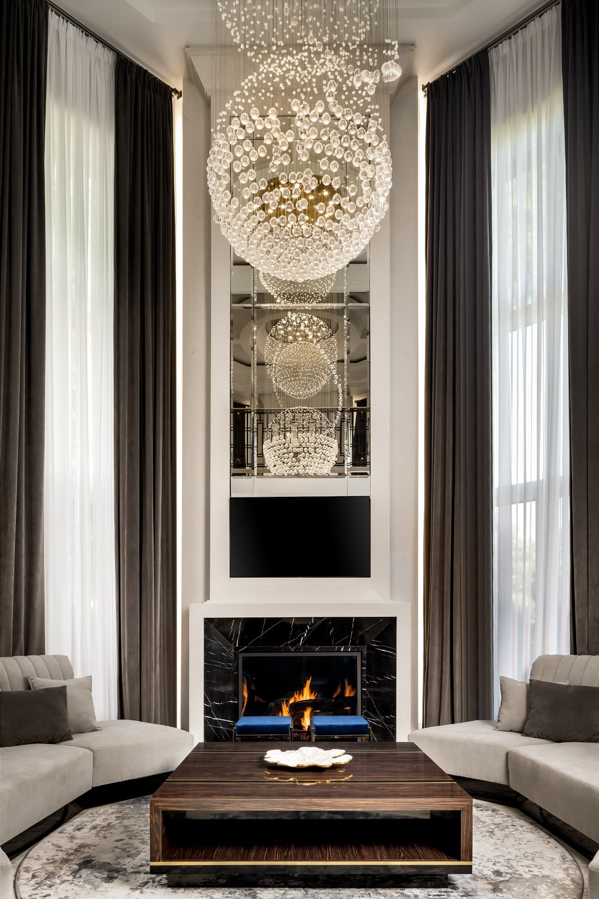 Grand hearth with a three-storey cascading crystal chandelier.